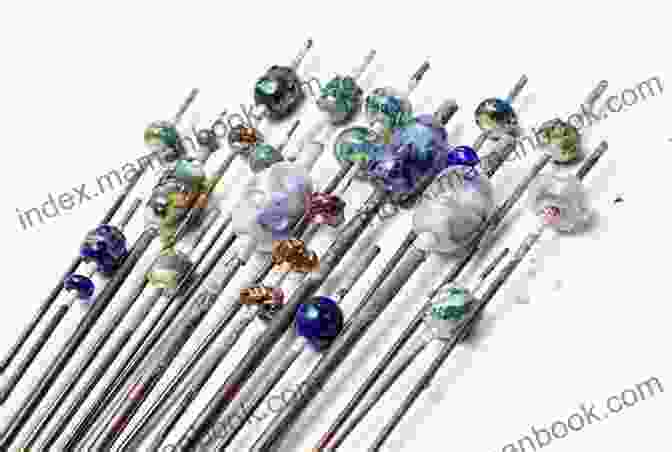 Image Of Various Glass Rods, Mandrel Rod, And A Heart Shaped Bead Release Mold. How To Make A Heart Lampwork Bead